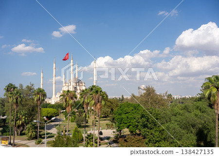 Sabanci Central Mosque in Adana, Turkey with Minarets and Turkish Flag under Blue Sky Sabanci Central Mosque in Adana, Turkey with Minarets and Turkish Flag under Blue Sky 138427135