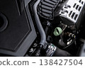 Engine oil dipstick check in car engine bay measuring oil level in modern vehicle close-up 138427504