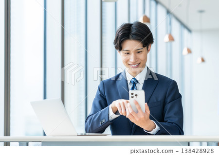 Young businessmen working in an office. Photo courtesy of Denpa Gakuen, Tokyo Electronics College. Young businessmen working in an office. Photo courtesy of Denpa Gakuen, Tokyo Electronics College. 138428928