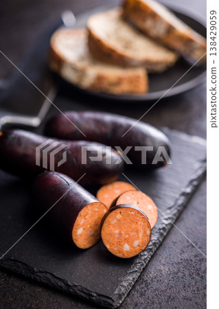 Smoked Sausage With Dark Casing Sliced Closeup on Rustic Surface, Deli Meat Appetizer Smoked Sausage With Dark Casing Sliced Closeup on Rustic Surface, Deli Meat Appetizer 138429059