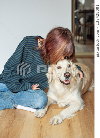 Young girl bonding with golden retriever dog companion Young girl bonding with golden retriever dog companion 138429091