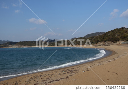 A landscape of the bay, the sea, the shoreline, the sandy beach, the trees on the mountain, clouds, and blue sky. A landscape of the bay, the sea, the shoreline, the sandy beach, the trees on the mountain, clouds, and blue sky. 138429288