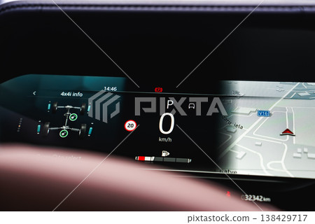 Close up digital instrument cluster shows 4x4i data, speed at 0 kmh in Park, V16 on the map, 8 C temperature, and 20 kmh zone, with crisp graphics and minimal reflections. Close up digital instrument cluster shows 4x4i data, speed at 0 kmh in Park, V16 on the map, 8 C temperature, and 20 kmh zone, with crisp graphics and minimal reflections. 138429717