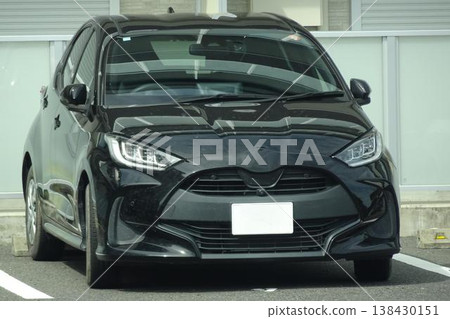 Passenger cars lining up in the parking lot 138430151