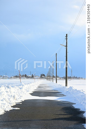 A snowy road and utility poles in the Echigo Plain (Niigata City, Niigata Prefecture) A snowy road and utility poles in the Echigo Plain (Niigata City, Niigata Prefecture) 138430440