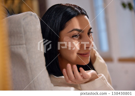 Woman wearing under eye patches looking at camera. Woman wearing under eye patches looking at camera. 138430801