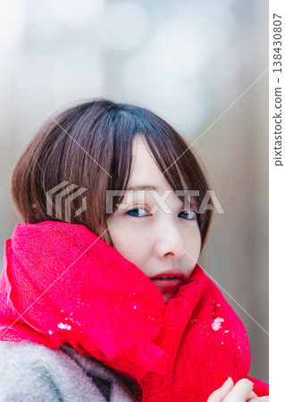 A young lady who played a muffler A young lady who played a muffler 138430807
