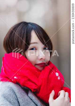 A young lady who played a muffler A young lady who played a muffler 138430809
