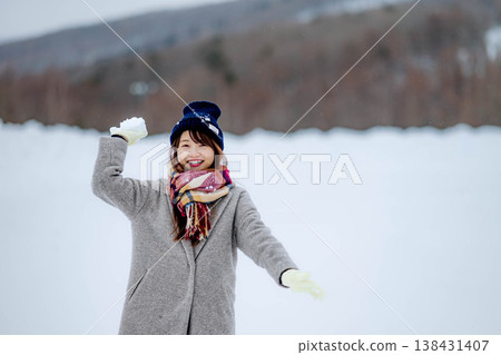 Young women playing in the snow Young women playing in the snow 138431407