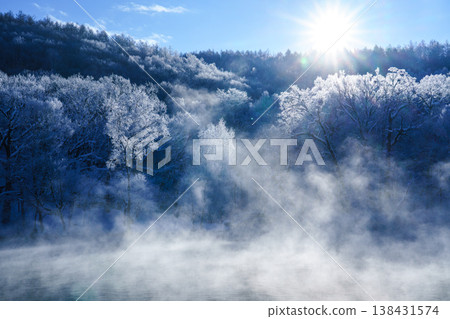 Torinuma Park, enveloped in frost and sea fog, presents a fantastical winter scene in Furano, Hokkaido. Torinuma Park, enveloped in frost and sea fog, presents a fantastical winter scene in Furano, Hokkaido. 138431574