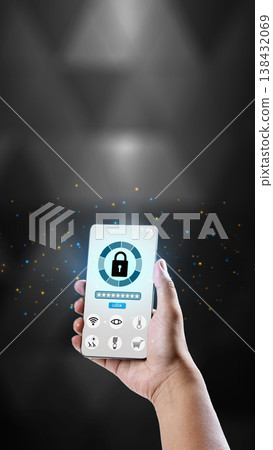 A hand holds a smartphone displaying a digital security interface with a large padlock icon and password field, set against a dark background with glowing particles 138432069