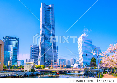 Yokohama cityscape, Japan, April 2nd. A view from in front of Yokohama City Hall, showing houseboats, Yokohama Landmark Tower, ropeway, and more. Yokohama cityscape, Japan, April 2nd. A view from in front of Yokohama City Hall, showing houseboats, Yokohama Landmark Tower, ropeway, and more. 138432583