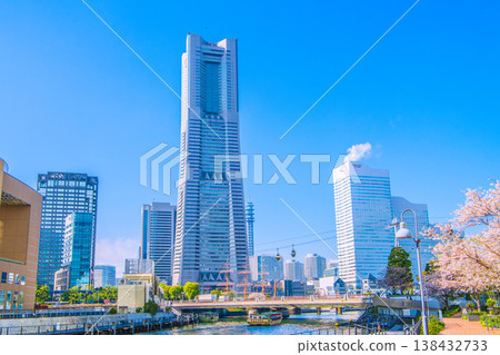 Yokohama cityscape, Japan, April 2nd. A view from in front of Yokohama City Hall, showing houseboats, Yokohama Landmark Tower, ropeway, and more. Yokohama cityscape, Japan, April 2nd. A view from in front of Yokohama City Hall, showing houseboats, Yokohama Landmark Tower, ropeway, and more. 138432733
