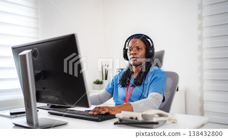 African American nurse providing telehealth medical support 138432800