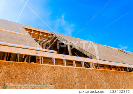 Workers are building roof trusses structure at construction site Workers are building roof trusses structure at construction site 138432875