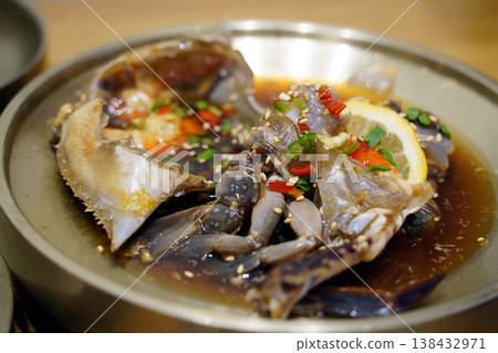 Traditional Korean soy marinated raw crab (Ganjang-gejang) served in a golden brass bowl Traditional Korean soy marinated raw crab (Ganjang-gejang) served in a golden brass bowl 138432971