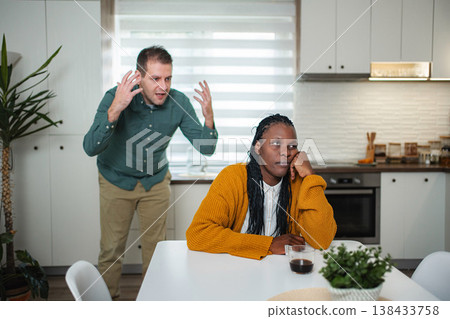 Couple having heated domestic argument in kitchen 138433758