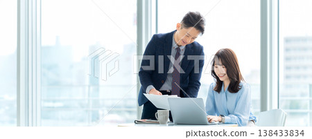 Image of business professionals using laptops for meetings (for landing pages and banners) Image of business professionals using laptops for meetings (for landing pages and banners) 138433834