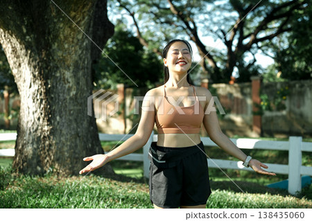 Woman enjoying calm wellness moment therapy in nature Woman enjoying calm wellness moment therapy in nature 138435060
