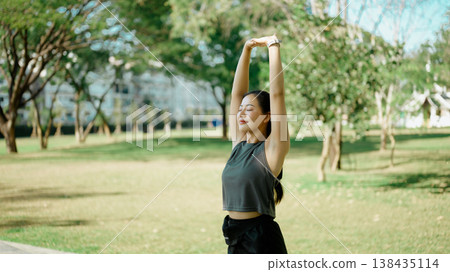 Beautiful woman practicing fitness in nature park before running 138435114