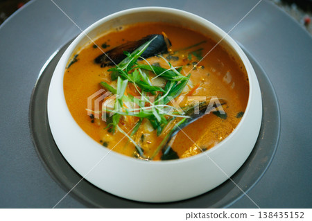 Artisan creamy soup with mussels and garnishes Artisan creamy soup with mussels and garnishes 138435152