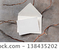 Blank card and envelope mockup on grey stone with dry branches, copy space. Stationery suite minimal template 138435202