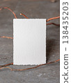 Blank card mockup on grey stone with dry branches, copy space. Minimal rustic stationery template 138435203