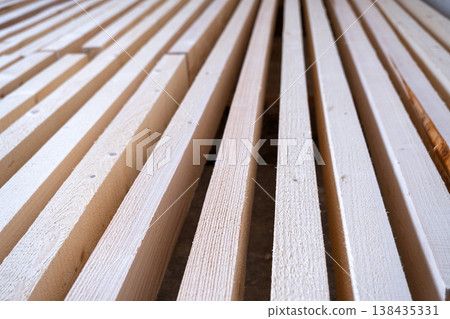 Construction wood laths, parallel arrangement for frame, decorating, repairing, crate, partition, wall elements, professional building component, interior fitout. Construction wood laths, parallel arrangement for frame, decorating, repairing, crate, partition, wall elements, professional building component, interior fitout. 138435331