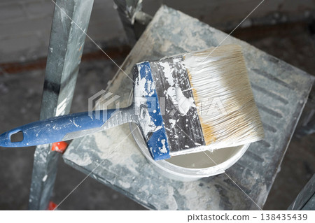 Ladder with paint and brush, surface prep for painting, home finishing, renovation work, interior improvement, room decoration detail. Ladder with paint and brush, surface prep for painting, home finishing, renovation work, interior improvement, room decoration detail. 138435439