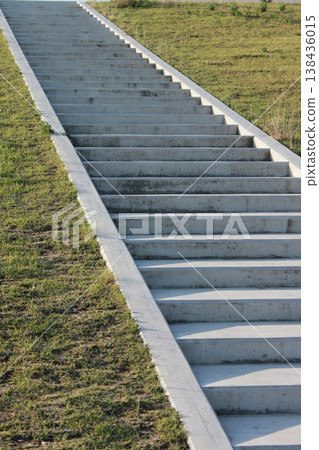 The park's long concrete staircase and green lawn 138436015