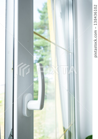 Reliable PVC window handle for smooth opening and locking, high-precision hardware, protection from draft and noise, benefits of double-glazed units, professional installation. 138436102
