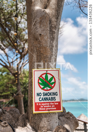 No smoking cannabis warning sign attached to tree near tropical beach on Koh Samui Thailand No smoking cannabis warning sign attached to tree near tropical beach on Koh Samui Thailand 138436226