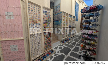 A narrow cobbled street full of souvenirs on the walls of the old town A narrow cobbled street full of souvenirs on the walls of the old town 138436767