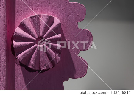 Close-up of a pink painted wooden rosette 138436815