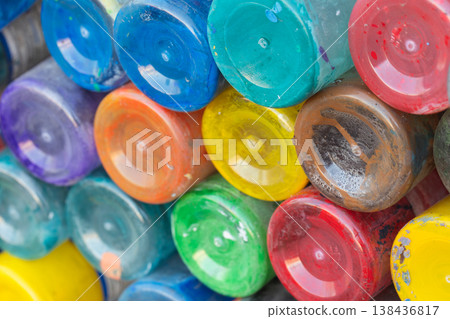 Bright, multicolored paint jars stacked in a composition Bright, multicolored paint jars stacked in a composition 138436817
