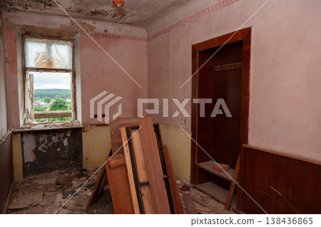 Abandoned Room With Peeling Pink Walls And Broken Window Overlooking Green Landscape In Dilapidated House Interior Scene Abandoned Room With Peeling Pink Walls And Broken Window Overlooking Green Landscape In Dilapidated House Interior Scene 138436865