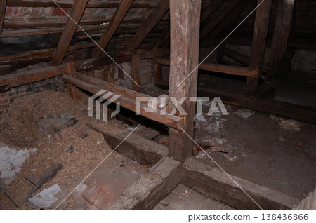Ancient Wooden Beam Structure Inside Dim Attic With Brick Walls And Scattered Debris Showing Rustic Textures And Historical Decay In Low Light Conditions Ancient Wooden Beam Structure Inside Dim Attic With Brick Walls And Scattered Debris Showing Rustic Textures And Historical Decay In Low Light Conditions 138436866