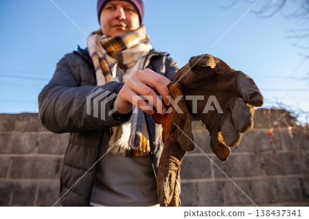 brown leather welding gloves of cowhide leather to welding with an electrode or gas protection. against hand burns during brown leather welding gloves of cowhide leather to welding with an electrode or gas protection. against hand burns during 138437341