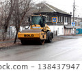 Petropavlovsk, Kazakstan - November 23, 2025: Blue road roller parked on street near trees 138437947