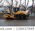 Petropavlovsk, Kazakstan - November 23, 2025: Yellow road roller machine parked on street 138437949