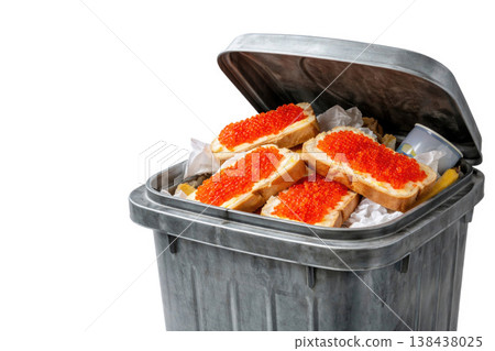 Sandwiches with red caviar in an open dumpster. Space for text. Sandwiches with red caviar in an open dumpster. Space for text. 138438025