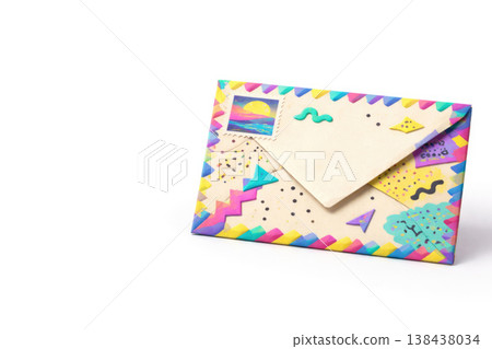 Decorative postal envelope with a stamp on a light background. Space for text. Decorative postal envelope with a stamp on a light background. Space for text. 138438034