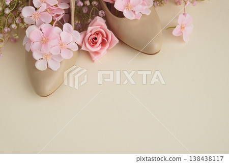 Beige High Heels with Pink Flowers on Cream Background. Beige High Heels with Pink Flowers on Cream Background. 138438117