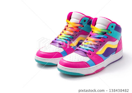 A pair of bright high sneakers with multi-colored laces on a white background. Space for text. A pair of bright high sneakers with multi-colored laces on a white background. Space for text. 138438482