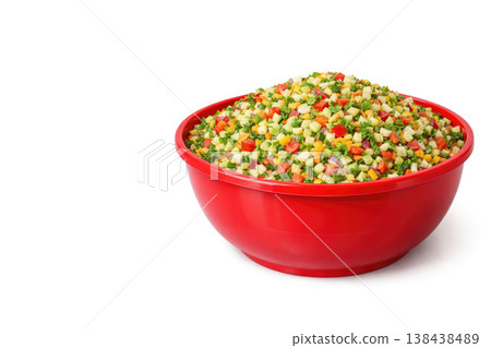 Red bowl with sliced vegetable salad on a light background. Space for text. 138438489