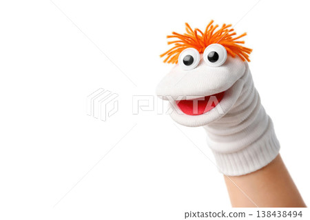 White sock doll with big eyes on a light background. Space for text. White sock doll with big eyes on a light background. Space for text. 138438494