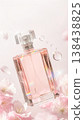 Levitating pink perfume bottle with rainbow prisms, surrounded by soft cherry blossoms and petals 138438825