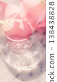 Macro shot of transparent cosmetic gel with air bubbles on white marble with soft pink rose petals 138438828