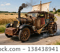 An old steam car with a sail on a country road. 138438941