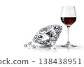 A large diamond and a glass of red wine on a white background. Space for text. 138438951